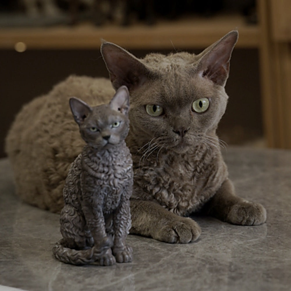 Harry the cat beside the hand-painted figure Sosielle made of him